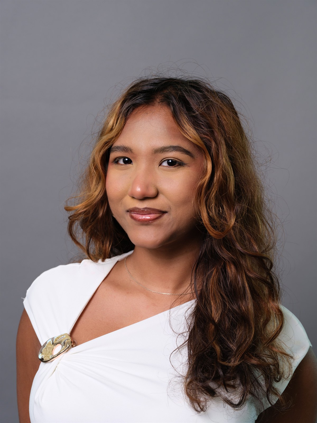 Professional headshot on grey